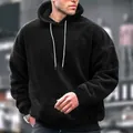 Close-up view of a premium men's oversized black sherpa fleece hoodie with hood - S / Tops / Black