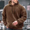 Close-up detail of a brown coral fleece oversized hoodie for men featuring drawstrings - S / Tops / Camel