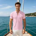 Detail view of pink men's casual T-shirt featuring a lace-up V-neck design on boat - Pink