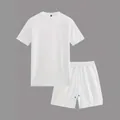 Detailed macro view of white waffle knit texture on breathable athletic shirt and shorts - S / Top And Bottom / White