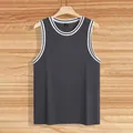 Close-up of charcoal gray men's ribbed knit tank top with white striped neck and armholes. - S / Tops / Carbon Gray