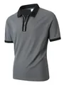 Graues Kurzarm-Poloshirt mit schwarzem Kontrastkragen und halbem Reißverschluss - Dunkelgrau