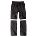 Detail of black convertible cargo pants showing detachable legs and multi-pockets - S / Bottoms / Black