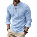 Detailed view of men's blue cotton linen Henley shirt in casual hippie beach style. - Light Blue