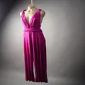 Detailed view showing the versatile fuchsia multi-way wrap bandage jumpsuit design - Rose Red