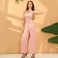 Elegant multi-way bandage jumpsuit in soft pink color featuring a wide leg silhouette - S / Top And Bottom / Pink