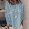 Detalle de sudadera azul claro con estampado Rock & Roll y estrella de diamantes - S / Tops / Azul claro
