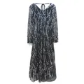 Close-up detail showing the silver wavy sequin patterns on a black V-neck dress - S / Top And Bottom / Black