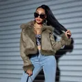 Detail view of women's olive green suede jacket with cozy faux fur trim and collar - S / Tops / Olive Green