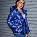 Stylish oversized shiny metallic blue hooded puffer jacket for unisex winter streetwear - M / Tops / Blue