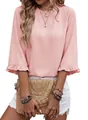 Detail of pink summer blouse featuring elegant ruffle round neck and feminine flared sleeves. - S / Tops / Pink