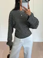 Detail view showing the fabric texture of a black and white striped batwing sleeve shirt top - S / Tops / Black Stripe