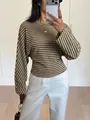 Macro view showing the detailed brown and white striped pattern on a batwing sleeve t-shirt - S / Tops / Brown Stripes