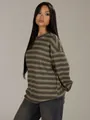 Detail of oversized striped crewneck sweatshirt in autumn earth tones worn by model - S / Tops / Khaki