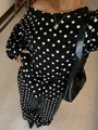 Detailed view of the black and white polka dot lounge set featuring an off-shoulder top. - S / Top And Bottom / Black