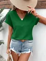 Detail showing the textured fabric and V-neck of this green summer top for women. - XS / Tops / Green