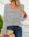 Close-up detail of a square neck striped T-shirt with elegant ruffled long sleeve cuffs - S / Tops / White