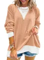Close-up detail of textured color-block sweatshirt showing waffle knit fabric and cuffs - S / Tops / Orange