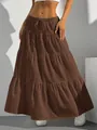 Detailed view of women's brown tiered maxi skirt with bohemian flowing design. - Dark Brown