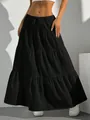 Detailed view of black tiered maxi skirt with drawstring elastic waist and textured fabric. - S / Bottoms / Black