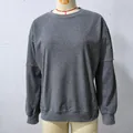 Gray long-sleeve sweatshirt with stylish striped patchwork sleeves on mannequin - S / Tops / Gray