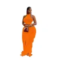 Detail of orange knitted two-piece beach set featuring a halter crop top and fringe skirt - S / Top And Bottom / Orange