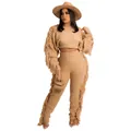 Close-up of boho fringe knit two-piece set with waffle texture and long tassels - Apricot