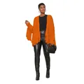 Close-up of bright orange knitted cardigan with trendy fringe details on a model. - S / Tops / Orange