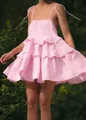 Detailed close-up view of a pink tiered ruffled summer mini dress featuring spaghetti straps - S / Dresses / Pink