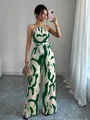 Detailed view of a stylish green abstract print halter neck wide-leg jumpsuit - S / Top And Bottom / Dark Green