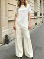 Elegante top in raso bianco con finiture in pizzo e pantaloni a gamba larga - Taglia S / Top / Bianco