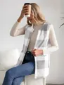 Fashionable women's gray and white plaid fuzzy vest over a cozy beige turtleneck - S / Tops / Light Gray
