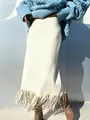 Elegant cream-colored suede H-line maxi skirt featuring a long fringe hem for women - S / Bottoms / Off White