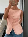 Women's pink textured sleeveless button-down top with a slim fit and chic summer style. - Hot Pink