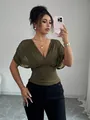 Fashionable olive green deep V-neck ruched waist top styled on model for chic look - S / Tops / Army Green