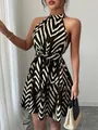 Detail shot of a stylish halter neck mini dress with black and white zigzag prints - S / Bottoms / Black