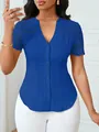 Detail showing lace embroidery on shoulders and slim fit of the blue button-up blouse - Blue