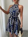 Close-up of a chic halter sleeveless mini dress featuring a navy wave stripe print - S / Bottoms / Blue