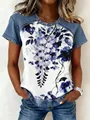 Detailed view of women's floral print top with denim-style sleeves and crew neck - S / Tops / Large Floral