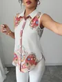 Élégant chemisier sans manches avec imprimé cachemire vibrant et détail de col blanc - S / Hauts / Fleurs Blanches