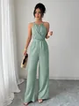 Full view of a sage green halter-neck jumpsuit with a waist-tie on a model - S / Bean Green