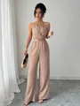 Chic beige halter neck jumpsuit with cinched waist and elegant wide-leg drape - S / Khaki