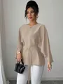 Detailed view of elegant French retro top with stylish flare sleeves and matching belt accessory - Khaki