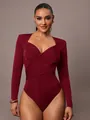 Detail of burgundy velvet bodysuit featuring a crossover V-neck and ruched design - S / Tops / Burgundy
