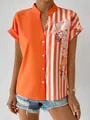 Detailansicht eines orangefarbenen Damen-Shirts mit Blumenmuster, Streifen und Knopfleiste - S / Oberteile / Orangerot
