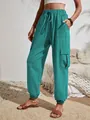 Pantalones cargo turquesa para mujer con bolsillos laterales y cintura con cordón - S / Bottoms / Verde