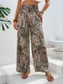 Vista dettagliata di pantaloni a gamba larga con stampa paisley e vita alta elastica - Albicocca