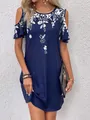 Close-up view of navy blue dress featuring white floral print and cold-shoulder design - S / Top And Bottom / Dark Blue