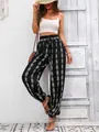 Detailed full length shot showing the pattern and fit of boho print lantern pants - S / Bottoms / Black