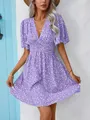 Detailed view of the purple floral print and elegant V-neck design on the summer dress - Purple